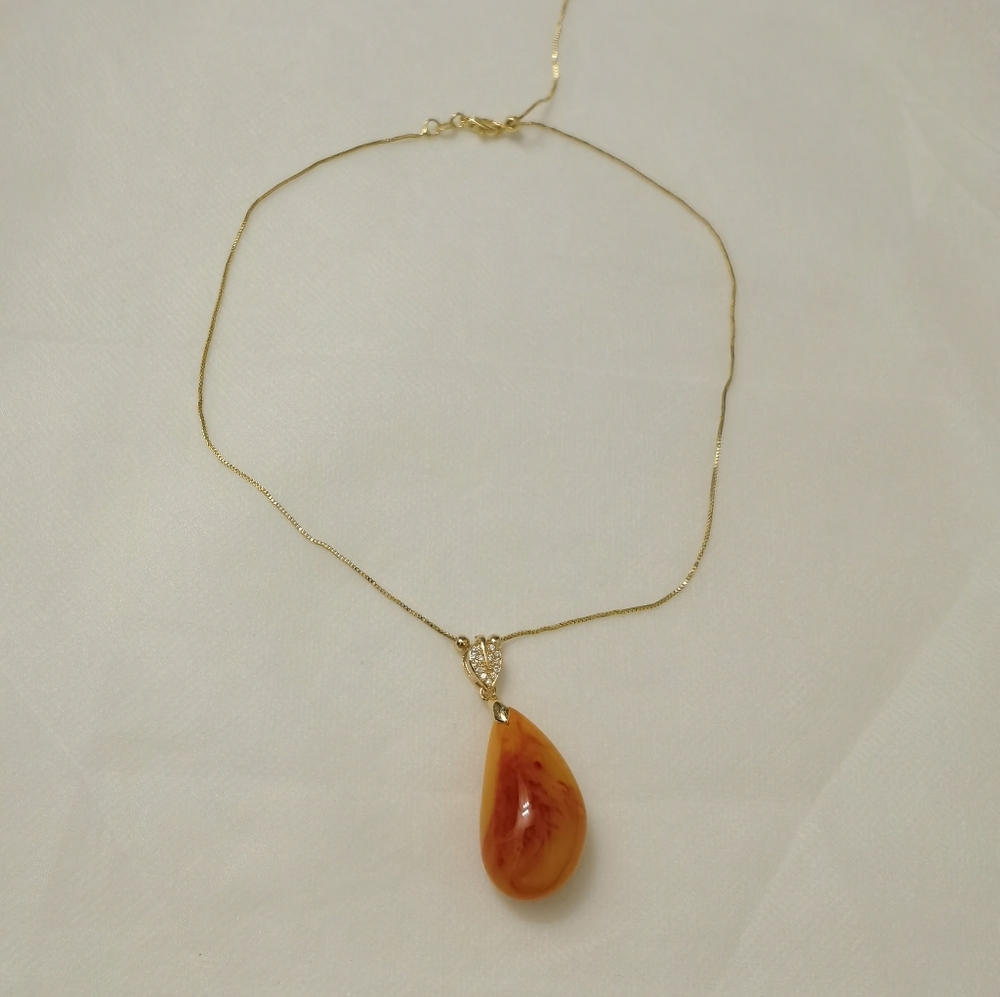 Amber pendant with adjustable necklace.